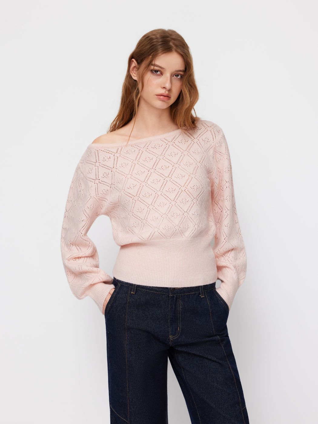 Button front cardigan in mid-weight gauge with custom button trim and side-seam pockets for everyday wear