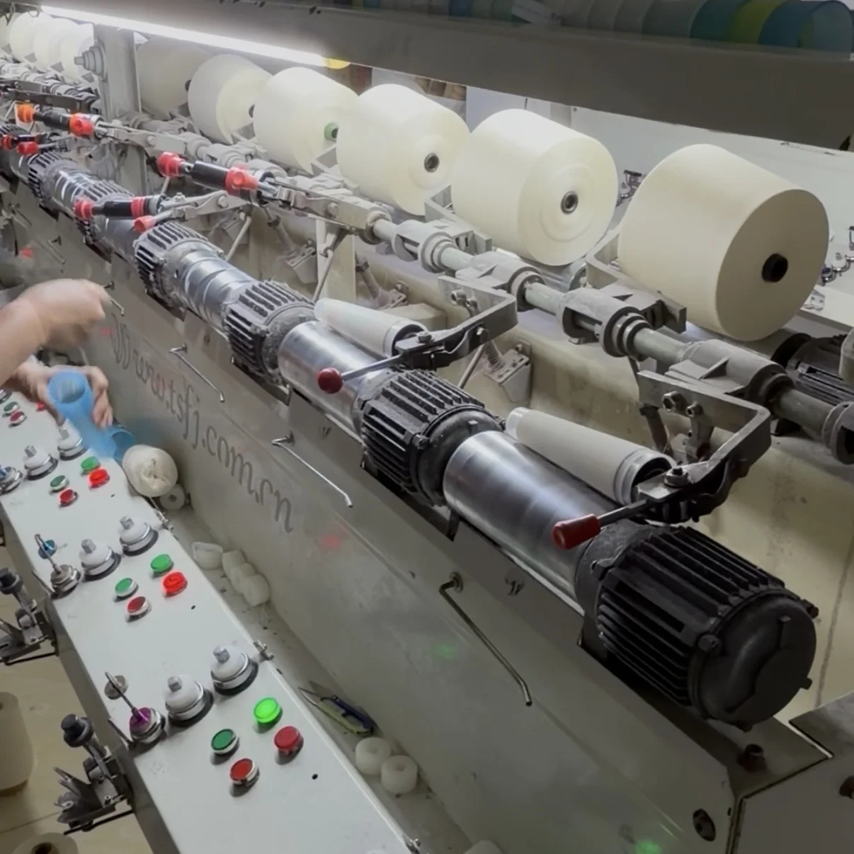 Quality control inspection of knitwear fabric tension and stitch consistency on a production line