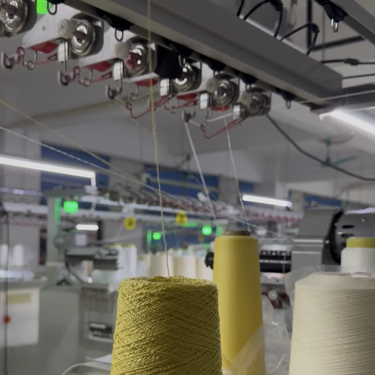 Quality inspection station where knitwear garments are checked for defects against AQL 2.5 international standards